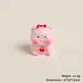 Detailed view of pink resin pig figurine holding red heart with size measurements - Heart Pink Pig