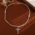 Multilayer pearl necklace with silver crystal cross pendant on dark velvet base - White K 6728-Silver Center Diamond Cross Pearl Necklace