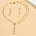 Macro shot of elegant gold bridal jewelry set with sparkling white rhinestones - 446 Gold Stud Earrings Necklace Set