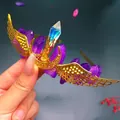 Detail of handmade gold crown featuring purple crystals and intricate metal wing accents - Purple Crystal + Gold Wing Moon