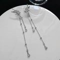 Detail view of silver butterfly tassel earrings with sparkling crystal accents - Streamlined Butterfly Faux Crystal Style (K1497)