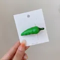 Creative green chili pepper hair clip made of glossy resin on a branded display card - Small Green Chili