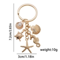 Goldener Schlüsselanhänger mit Muschelperle und Seesternanhängern, Länge 7,2 cm - LS377 Ozean Anhänger Set