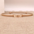 Detail of camel leather slim belt with gold metal hook buckle on textured fabric - Apricot