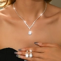 Macro detail of teardrop zircon jewelry set with silver necklace and stud earrings - 2-Piece Set / Silver