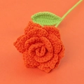 Handmade crochet rose flower in vibrant orange yarn with green leaf and stem details - Sharp Corner Rose-Orange