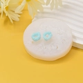 Moule en silicone pour beignets et gâteaux avec des créations finies bleues montrées - Style Beignet Rond Multi-trous