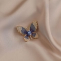 Elegant gold butterfly brooch with blue and white crystals on champagne silk background - 533# Blue Butterfly