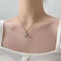 Detailed view of pink heart pendant necklace with arrow design on female model's collarbone - Silver Pink Gemstone Style (7919)