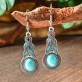 Macro view of vintage silver drop earrings with blue turquoise stones on a branch - Sky Blue Main Stone (HQEF-0319)
