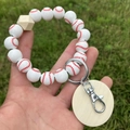Baseball themed beaded wristlet keychain with wooden beads on green grass background - White Baseball Style