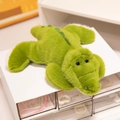 Soft plush crocodile toy in grass green with fluffy texture and a lying posture - Crocodile