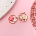 Pink enamel ocean shell and starfish charms in gold finish with pearls and rhinestones - Round Ocean Starfish Shell