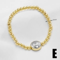 Style E variant 18k gold beaded elastic bracelet with heart charm and 5mm beads - Starburst Heart / 5mm Bead Diameter