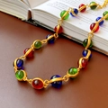 Close-up of vintage necklace with colorful glass beads on a retro book surface - Colorful Oval Style (18#)