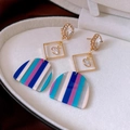 Detail of square zircon tassel earrings with blue striped acrylic fan pendant - Gold