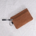 Brown canvas mini coin purse with metal zipper and key ring attachment for women - Tan