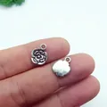 Macro detail of a 13x10mm retro silver alloy rose pendant for DIY jewelry making - 14# Embossed Small Flower