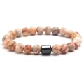 Elastic beaded bracelet with natural tiger eye round stones and black cylinder bead - Red Network Stone