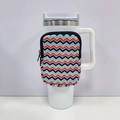 Detail of 40oz tumbler sleeve featuring a vibrant red and blue zigzag wave pattern - No. 15 Wave