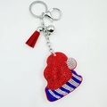 Macro detail of Christmas hat keychain with red rhinestones and matching silk tassel - Christmas Hat