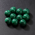 Spherical green malachite loose beads with distinctive black bands for jewelry making - Malachite Colored Stone