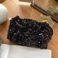 Vintage black velvet pouch with sequins and pearl accents on a rustic wooden desk - Black