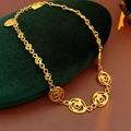 Detail of vintage gold flower necklace with hollow rose pendants on a green jewelry box - Necklace - Gold
