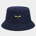 Close-up of a bee embroidery detail on navy blue canvas bucket hat with fine texture - One Size / Navy Blue