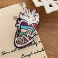Artistic anatomical heart hair claw clip featuring a colorful rainbow LOVE design - Heart-Shaped