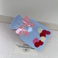 Close-up of light blue candy bag hair claw with a pink bow on a textured background - Blue Candy Bag/Wishing Bottle / 9.6cm*5.6cm