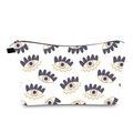 Close-up of water-resistant toiletry bag with blue and gold Evil Eye pattern print - White Gold Blue Pupil