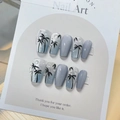 Macro detail of blue gradient press-on nails with palm trees and 3D water drops - By1588 Island Coconut Tree / Glue Type