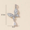 Macro view of butterfly pendant with pearls and cubic zirconia stones measuring 3.7cm height - Silver Pearl Butterfly