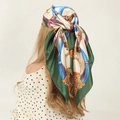 Green and beige silk square scarf with golden chain patterns worn by a blonde model - 90*90cm / Chain Green