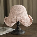 Elegant pink straw sun hat with large bow decoration on a classic wooden stand - L (58-60cm) / Solid Bow Decor Pink