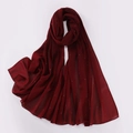 Detailed view of dark red pearl chiffon shawl with shimmering rhinestones on white background - Burgundy