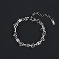 Detailed macro of vintage silver oval links with adjustable lobster clasp on black pad - Hollow Oval Knot (Style 4) / Silver
