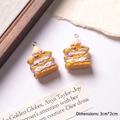 Macro detail of 3cm resin cake pendants with strawberry and jam layers for DIY crafts - Purple Yellow + White Filling