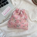 Detail of pink floral drawstring storage bag with textured fabric on white background - Flower Yellow Rabbit