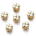 Macro view of six gold clover-shaped beads with a polished finish and center holes - Gold Style 04 (Clover)