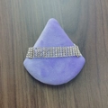 Sparkling multi-row rhinestone choker necklace displayed on purple velvet triangle cushion - White Rhinestone Decor / Purple
