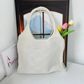 Detail of cream-white knitted tote bag with hollow weave texture and artistic Parisian style - Off White