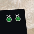 Detail of green chalcedony earrings with zircon micro-paving on black velvet board - Silver Zircon Green Chalcedony Stud Earrings