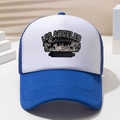 Macro shot of breathable blue polyester mesh and stitching details on a trucker hat - Sapphire Blue