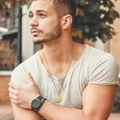 Men's double-layered gold necklace featuring a compass travel pendant on a male model - Cross Chain Gold / Standard