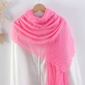 Pink pleated cotton linen scarf with frayed edges displayed on a wooden hanger - Pink