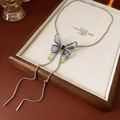 Detail of silver butterfly pendant with blue-purple gradient and green water-drop beads - Necklace - Silver - Blue
