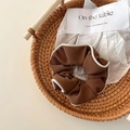 Deep brown ribbed ballet hair scrunchie with cream contrast piping in a woven tray - Coffee Goddess Contrast