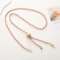 Pink leather woven with gold metal chain featuring a sphere adjustment buckle - Pink